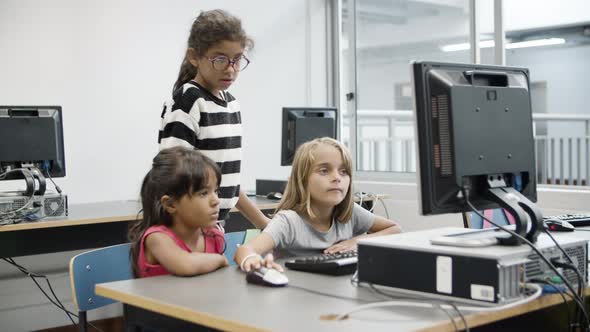 Multiethnic Girls Discussing Task on Computer Science