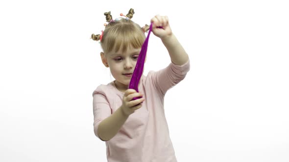 Kid Playing with Hand Made Toy Slime. Child Having Fun Making Purple Slime