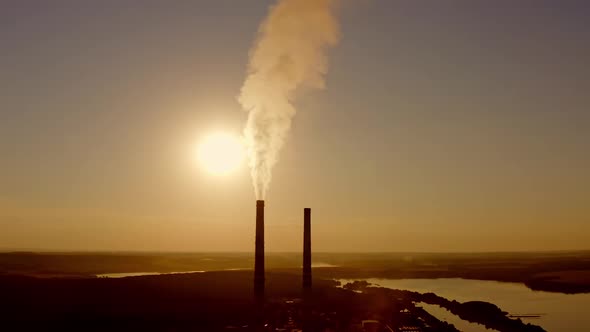 Industrial pipe with white smoke