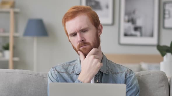 Pensive Beard Man Thinking While Using Laptop