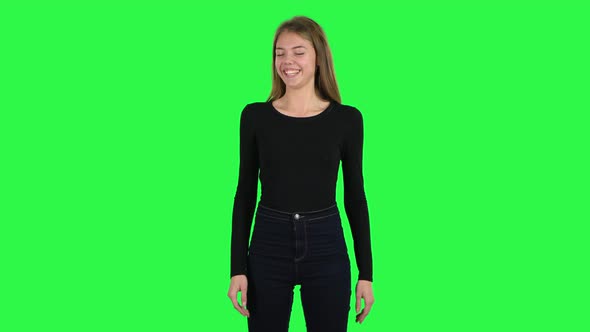 Young Woman Throwing Up Hands Expressing She Is Innocent. Green Screen