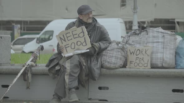 The Inscription "Need Food" By a Poor Homeless Tramp. Kyiv. Ukraine