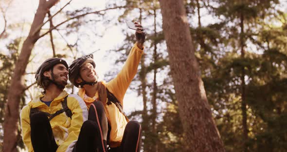 Mountain biking couple taking a selfie
