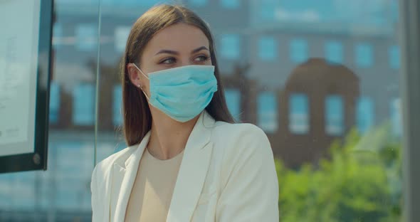 Young Beautiful Woman with Respiratory Virus Wearing Mask at Street Outdoor in City. Healthcare and