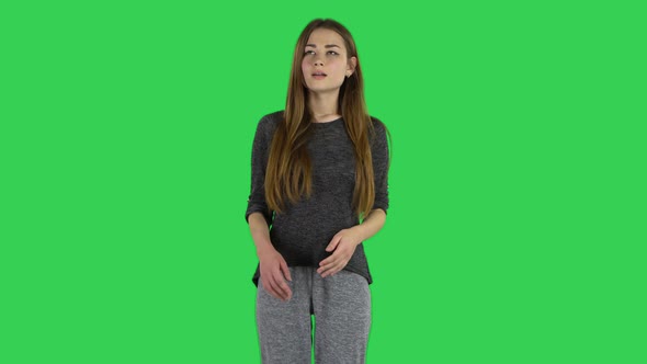 Cute Brunette with Long Hair Is Daydreaming on a Green Screen