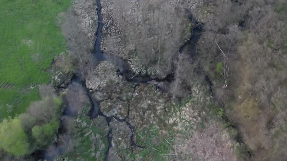 Countryside aerial footage with green fields and cottages. Spring time.