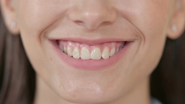 Close Up of Mouth of Smiling Young Woman 