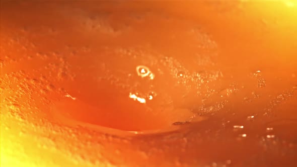 A Whirlpool of Orange Juice with Air Bubbles