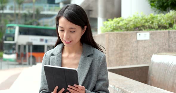Business woman use of tablet computer in Hong Kong
