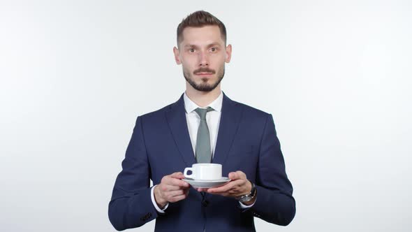 Emotionless Businessman Suggesting Cup of Coffee