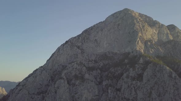 Grand view of sunlight shining on the rocky mountain peak in the Geyikbayiri limestone mountain rang