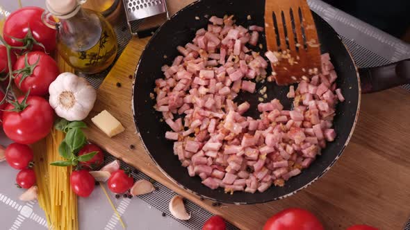 Making Pasta Carbonara  Mixing Chopped Pancetta Bacon in Frying Pan