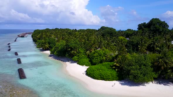 Drone view scenery of marine seashore beach break by blue lagoon and sand background