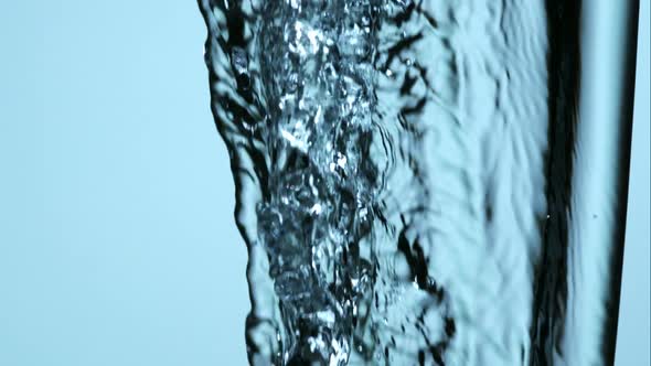 Water pouring and splashing in ultra slow motion 1500fps on a reflective surface - WATER POURS 