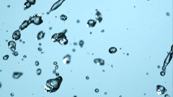 Water pouring and splashing in ultra slow motion 1500fps on a reflective surface - WATER POURS alt