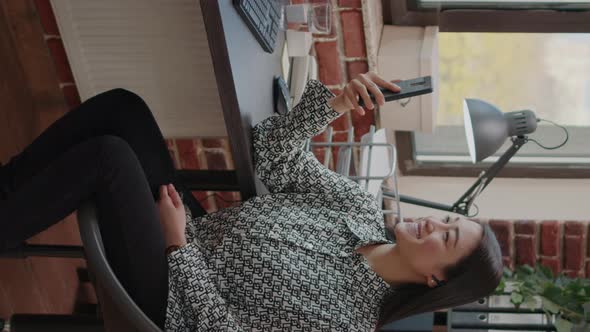 Vertical Video Person Holding Smartphone to Talk on Video Call to Colleague