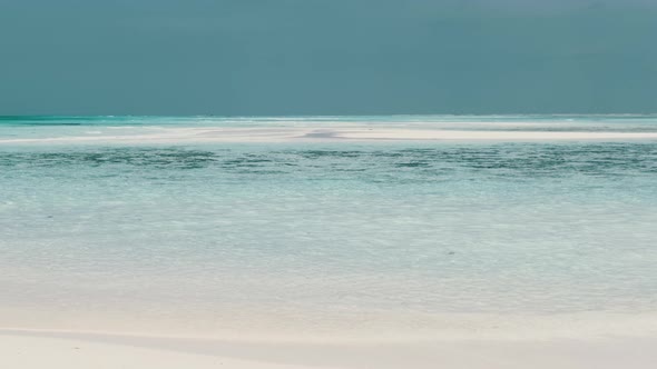 Empty Paradise Beach with White Sand and Clear Water in Ocean Zanzibar Mnemba