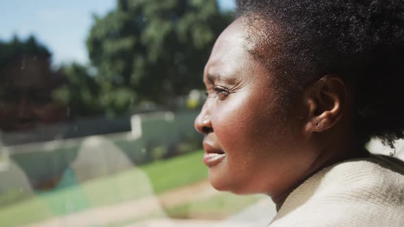 Senior african american woman standing by window