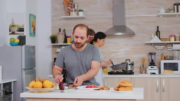 Wife Cooking Eggs for Husband