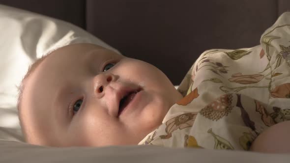 Indoor Portrait of Happy Six Months Old Baby Girl