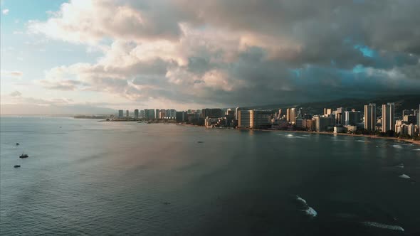 Aerial drone footage of Honolulu, Hawaii. Beautiful real estate, buildings in the city. Palm trees