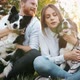 Beautiful Couple Cuddling and Walking Dogs Outdoors - VideoHive Item for Sale