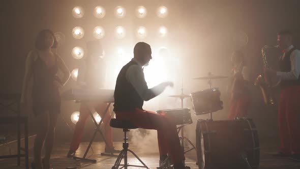 Talented Drummer Performing at Night Club