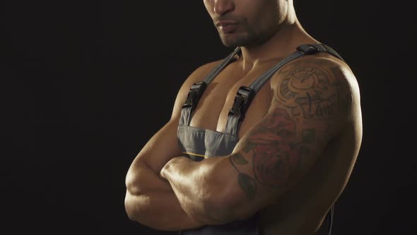 Young Handsome Sexy Builder in Uniform Smiling To the Camera