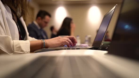 Woman Working on Laptop During Meeting 4K