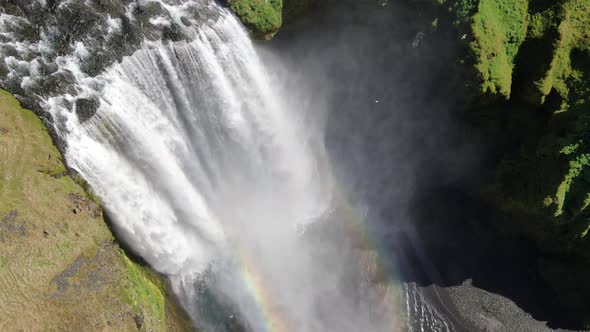 Double rainbow created by Skogafoss waterfall in Iceland, Europe (aerial view)