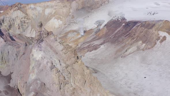 Aerial Drone Footage of Mutnovsky Volcano Crater with Fumaroles and Glacier
