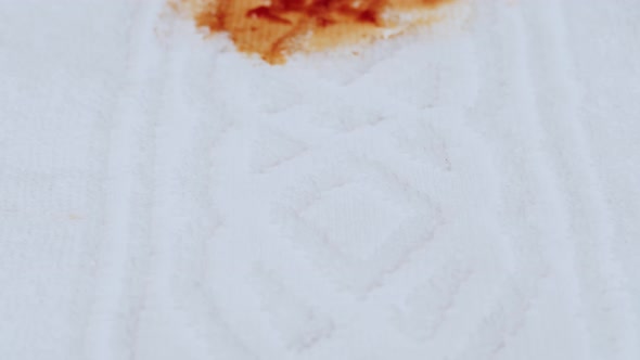 Stain From Spilled Ketchup on White Cloth Closeup