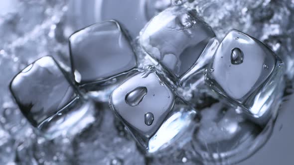 Super Slow Motion Shot of Clear Water Splashing on Ice Cubes at 1000 Fps