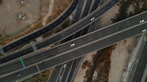 Aerial view of a highway intersection with some day traffic in Santiago city of Chile