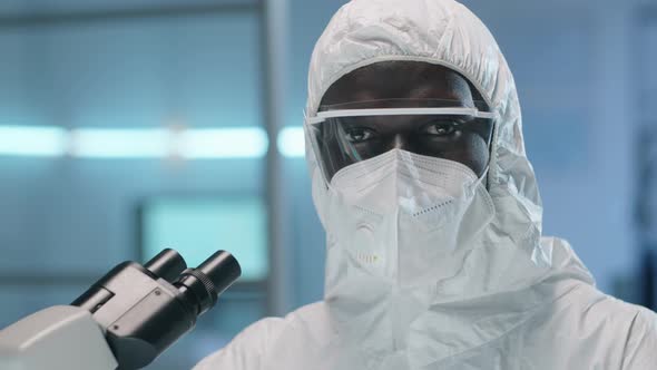 Portrait of Afro-American Lab Scientist in Protective Suit