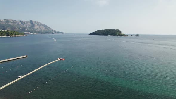 Aerial View of the Resort Sea Beach with Boats and Jet Skis in Budva Montenegro