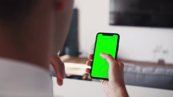 Human Arms Hold Electronics Gadget with Chromakey Touchpad Closeup. Guy Gesturing: Scrolling App By