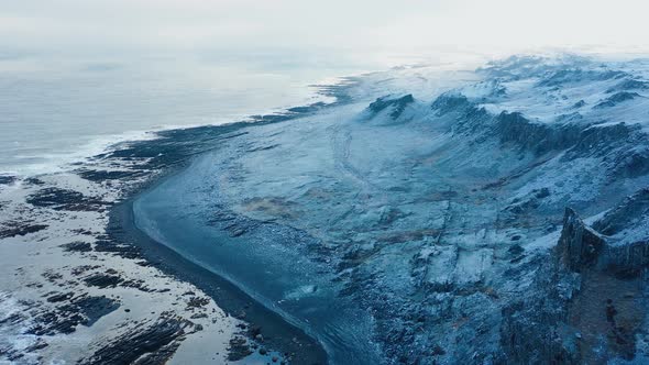 Majestic snowy landscape. Flying over a snow covered valley and mountains.