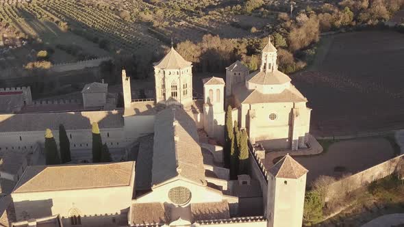 Aerial Royal Abbey of Santa Maria de Poblet Cistercian monastery At Sunset.