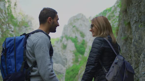 Couple pointing at mountain