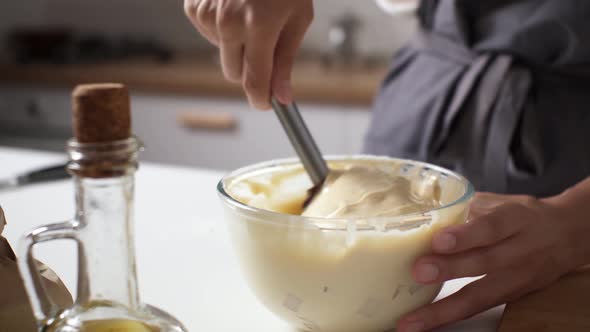 The Cook Kneads The Dough With A Glass Bowl With A Special Kitchen Spatula, Cooking From Vegetable