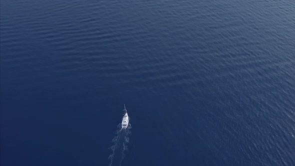 Aerial View Of A Sail Going To Journey On Beautiful Blue Color Sea