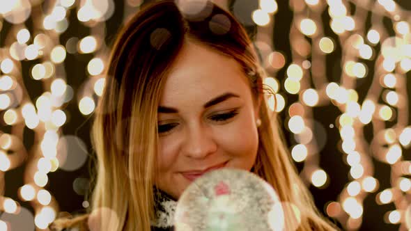 Cute Women in Front of Christmas Lights