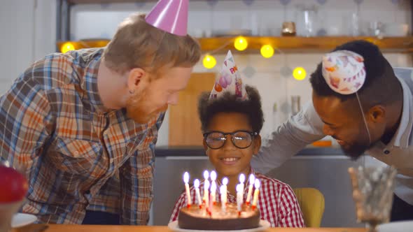 Happy Man Parents Celebrating Son Birthday Together at Home