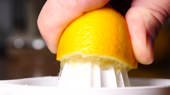 Hand Squeezeing Lemon Fruit