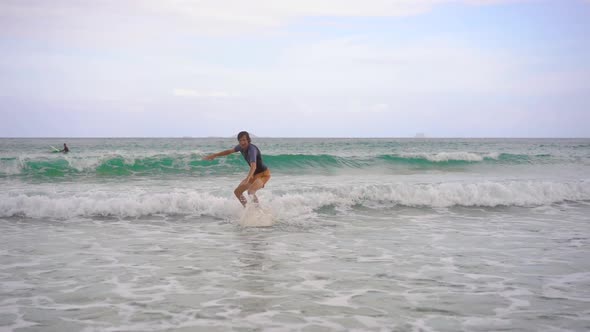 A Young Man Learns How To Surf