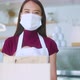 Attractive asian female cafe worker wears face mask and gloves - VideoHive Item for Sale