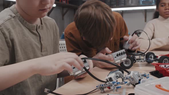 Modern Boys Building Robotic Models