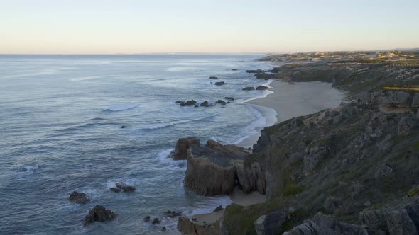 Praia do Malhao beach view at sunrise, in Portugal