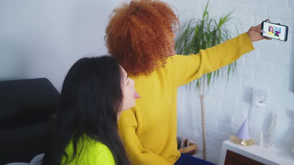 Multiracial Friendship. Asian and African American Black Woman Taking Selfie Using Smartphone